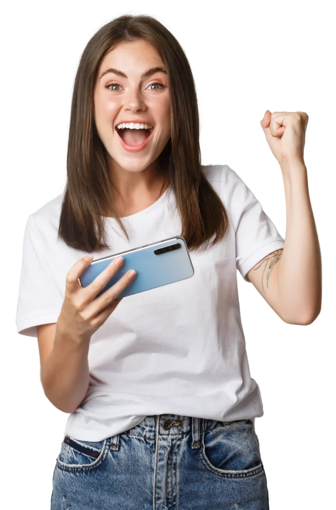 Excited woman celebrating success using a smartphone, smiling with fist raised.