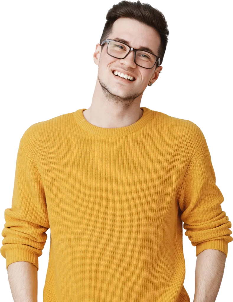 Smiling person in glasses wearing a yellow sweater, exuding happiness and confidence.