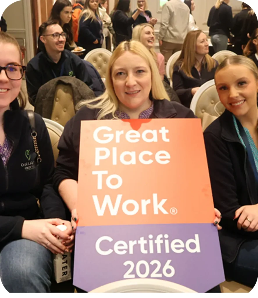 Employees celebrate certification as a Great Place to Work 2026, showcasing a positive workplace environment.