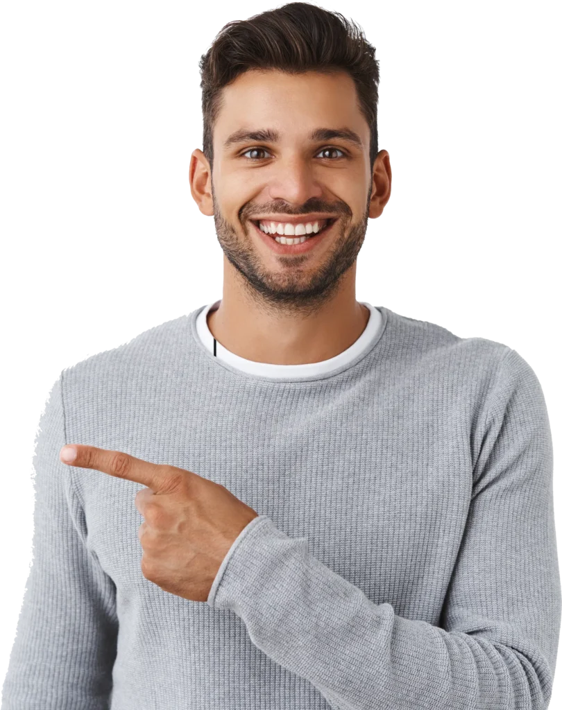 Smiling man in gray sweater pointing right, conveying positivity and engagement.