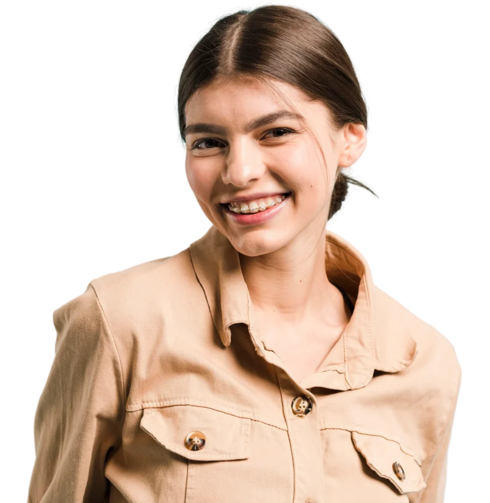Smiling woman with brown hair wearing a beige jacket.
